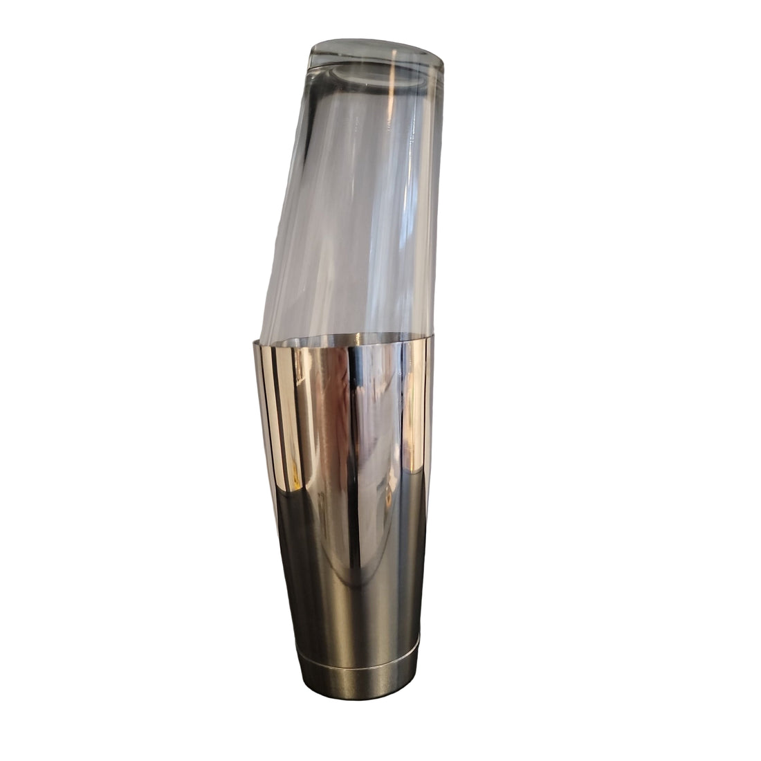 A silver and clear Boston shaker, consisting of two stacked cylindrical pieces, with the upper part being transparent and the lower part metallic.
